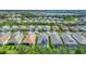 An aerial view of a sprawling residential community with well-maintained homes and lush landscaping at 8069 Tidal Pointe Way, Sarasota, FL 34240