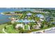 A breathtaking aerial view showcasing the community's pool, clubhouse, and waterfront location at 8069 Tidal Pointe Way, Sarasota, FL 34240