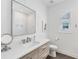 Stylish bathroom featuring modern fixtures, ample lighting, and patterned tile floor at 8069 Tidal Pointe Way, Sarasota, FL 34240