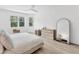 Bright bedroom with a large window and hardwood floors at 8069 Tidal Pointe Way, Sarasota, FL 34240