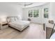 Bright bedroom with a large window and hardwood floors at 8069 Tidal Pointe Way, Sarasota, FL 34240