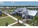 Aerial view of community center showcasing professional landscaping, walkways, and lush green spaces at 8069 Tidal Pointe Way, Sarasota, FL 34240