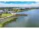 Community pond with waterside walking path and beautiful community amenities; great for recreation and relaxation at 8069 Tidal Pointe Way, Sarasota, FL 34240