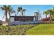 Entrance sign to Lakehouse Cove at Waterside community with lush landscaping at 8069 Tidal Pointe Way, Sarasota, FL 34240