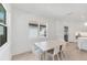 Bright dining area with a modern table and chairs at 8069 Tidal Pointe Way, Sarasota, FL 34240