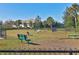 Community dog park featuring green space, benches, and play equipment perfect for active pets at 8069 Tidal Pointe Way, Sarasota, FL 34240