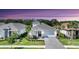 Charming single-story home boasts a well-manicured lawn, a brick driveway and a two-car garage at 8069 Tidal Pointe Way, Sarasota, FL 34240