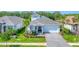 Charming single-story home with a neatly landscaped yard, gray roof, and welcoming entrance at 8069 Tidal Pointe Way, Sarasota, FL 34240