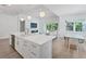 Open kitchen concept with a view to the living room and dining area at 8069 Tidal Pointe Way, Sarasota, FL 34240