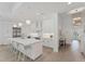Bright, modern kitchen with a large island, stainless steel appliances, and ample counter space for cooking at 8069 Tidal Pointe Way, Sarasota, FL 34240