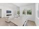Bright living room with a modern fireplace and a view to the backyard at 8069 Tidal Pointe Way, Sarasota, FL 34240