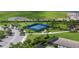 An aerial view of the community's tennis court, surrounded by lush greenery and well-maintained landscaping at 8069 Tidal Pointe Way, Sarasota, FL 34240