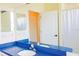 This bathroom features a blue counter, dual sinks, and a walk-in shower at 8979 Grey Oaks Ave, Sarasota, FL 34238