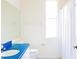 Bright bathroom featuring a blue counter, a walk-in shower, and updated fixtures at 8979 Grey Oaks Ave, Sarasota, FL 34238