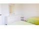 Bedroom with two twin beds and a large white dresser at 8979 Grey Oaks Ave, Sarasota, FL 34238