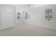 Large bedroom with carpet, natural light, and closet at 8979 Grey Oaks Ave, Sarasota, FL 34238