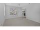 Bright and airy carpeted bedroom with a sliding glass door to the lanai at 8979 Grey Oaks Ave, Sarasota, FL 34238