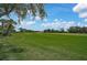 Enjoy the beautiful views of the lush golf course from this property's well-maintained grounds at 8979 Grey Oaks Ave, Sarasota, FL 34238