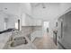Kitchen with white cabinetry, granite countertops and stainless steel appliances at 8979 Grey Oaks Ave, Sarasota, FL 34238