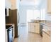 Bright kitchen featuring granite countertops and stainless steel appliances at 8979 Grey Oaks Ave, Sarasota, FL 34238