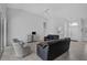 Bright living room with vaulted ceilings, tile floors, and ample natural light at 8979 Grey Oaks Ave, Sarasota, FL 34238