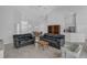 Spacious living room with tile flooring, neutral paint, and open floor plan at 8979 Grey Oaks Ave, Sarasota, FL 34238