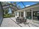 Relax on this large, screened-in patio with a beautiful view and easy access to indoor living spaces at 8979 Grey Oaks Ave, Sarasota, FL 34238