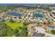 Expansive aerial view of a waterfront residential community with lush landscaping and beautiful lakes at 9016 30Th E St, Parrish, FL 34219