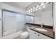 Bathroom offers granite countertops, a soaking tub with shower, and a mirrored vanity at 9016 30Th E St, Parrish, FL 34219