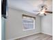 Bright bedroom includes a ceiling fan, and large window providing a lot of natural light at 9016 30Th E St, Parrish, FL 34219