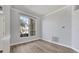 Well-lit empty room with wood floors and large window at 9016 30Th E St, Parrish, FL 34219