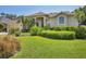 Landscaped front yard of a well-maintained home at 9016 30Th E St, Parrish, FL 34219