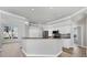 Bright kitchen with white cabinets, granite countertops, stainless appliances and breakfast bar at 9016 30Th E St, Parrish, FL 34219