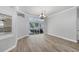 Bright living room featuring hardwood floors and sliding glass doors leading to the lanai at 9016 30Th E St, Parrish, FL 34219