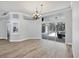 Bright, open living space featuring wood floors and sliding glass doors to an outdoor patio at 9016 30Th E St, Parrish, FL 34219