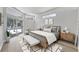 Bright main bedroom featuring neutral decor, wood furnishings, and patio access at 9016 30Th E St, Parrish, FL 34219