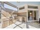 Covered outdoor kitchen includes a built-in grill, counter space, and tiled backsplash at 9016 30Th E St, Parrish, FL 34219