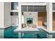 Relaxing backyard with a pool and an outdoor living area for entertaining friends and Gathering at 100 6Th S St, Bradenton Beach, FL 34217