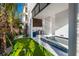 Backyard with outdoor kitchen, mini golf course and pool, perfect for entertainment at 100 6Th S St, Bradenton Beach, FL 34217