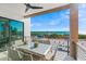Outdoor dining area with ocean views and modern railings at 100 6Th S St, Bradenton Beach, FL 34217