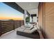 Stylish balcony featuring a lounge area with comfortable seating and scenic sunset views at 100 6Th S St, Bradenton Beach, FL 34217