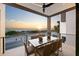Scenic outdoor balcony boasts stylish seating and a breathtaking ocean view, ideal for relaxing and enjoying the coastal scenery at 100 6Th S St, Bradenton Beach, FL 34217