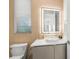 Stylish bathroom with textured walls and illuminated mirror at 100 6Th S St, Bradenton Beach, FL 34217