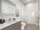 Bright bathroom featuring walk-in shower and modern vanity at 100 6Th S St, Bradenton Beach, FL 34217