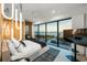 Luxury bedroom with a large window displaying beach view, modern lighting, and sleek furnishings at 100 6Th S St, Bradenton Beach, FL 34217