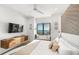 Modern bedroom with sleek floating cabinet and window seat overlooking the ocean at 100 6Th S St, Bradenton Beach, FL 34217