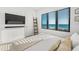 Bright bedroom with ocean views and a sleek flat screen provides a relaxing retreat at 100 6Th S St, Bradenton Beach, FL 34217