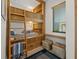Stylish bunk beds featuring natural wood with storage drawers creating a cozy bedroom at 100 6Th S St, Bradenton Beach, FL 34217