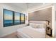 Inviting bedroom with ocean views from the window and complemented with modern accents at 100 6Th S St, Bradenton Beach, FL 34217