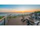 Stunning deck view with ocean view, outdoor seating, and hot tub create a relaxing oasis for enjoying sunsets at 100 6Th S St, Bradenton Beach, FL 34217